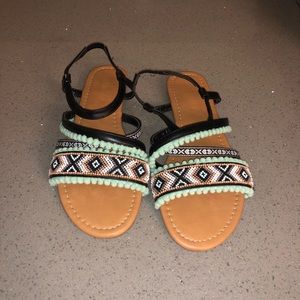 Beaded details with cute Pom Pom sandals.